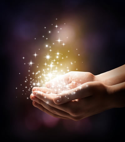 a person's hands with stars