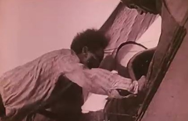 Houdini performing a mid-air transfer from one airplane to another